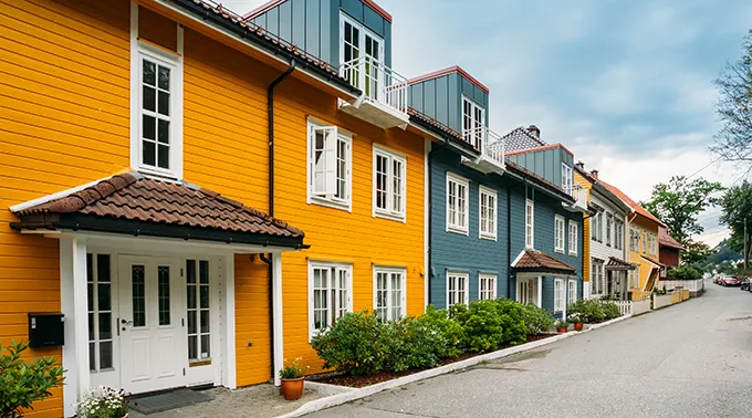 Colorful exterior houses showcasing professional exterior house painting service and roof painting service for a stunning look.