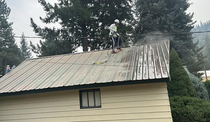 the painter is washing the roof