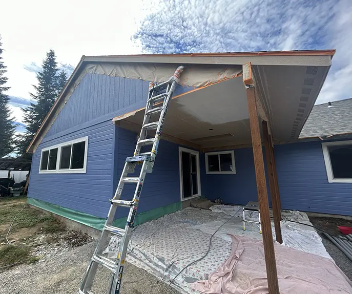 blue house exterior painting process