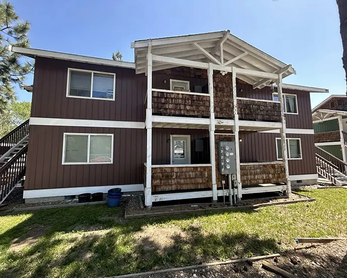 brown house after exterior cleaning and exterior painting