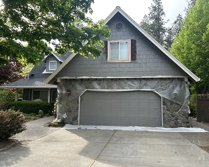 finished result of exterior painting of house in grey color