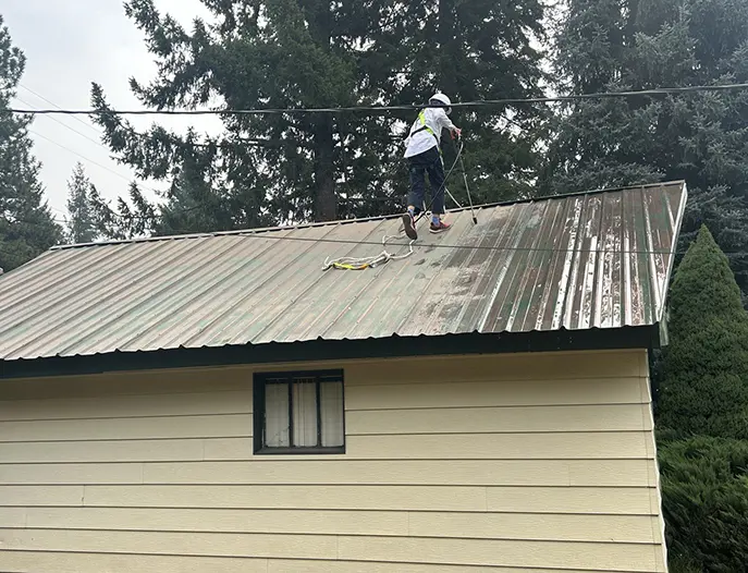 process of cleaning metal roof from rust and moss