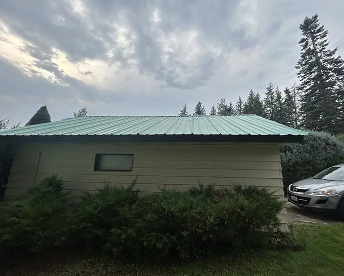 painted metal roof after cleaning from moss and rust