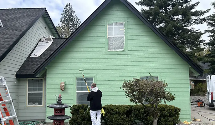 Exterior house painting service showcasing a freshly painted home with vibrant colors and pristine finishes.